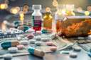 An array of pharmaceutical bottles and currency amidst a lab setting shrouded in twilight