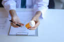 A general practitioner explains to acpatient about prescription