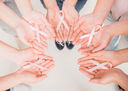 Women holding breast cancer ribbons