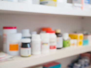 Close up of medicine bottles on the shelves at the pharmacy