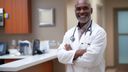 African American Male Doctor smiling in a clinic office