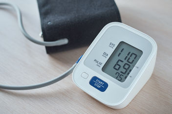 Digital blood pressure monitoring displaying healthy reading