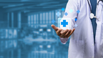 Doctor icon on a virtual screen with health care and medical icons in the background