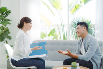 A female psychologist with a client in office