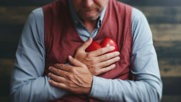 Older man with clenching his chest