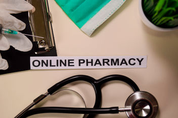 Online Pharmacy with inspiration and healthcare medical concept on desk background