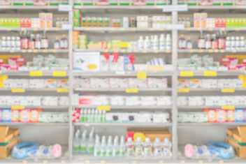 A pharmacy drugstore interior shelves with blurred background