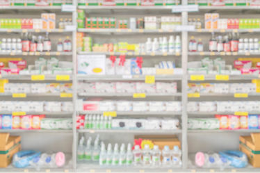 A pharmacy drugstore interior shelves with blurred background