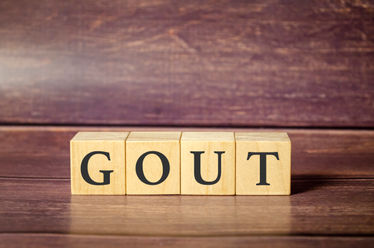Wooden blocks forming the word gout