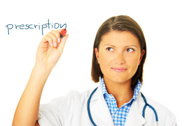 Female doctor writing prescription