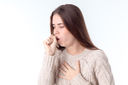 Young girl feeling ill and coughing