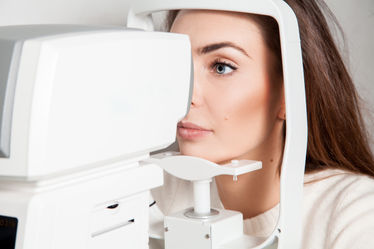 Woman getting an eye exam