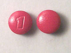 Esto es un Tableta rojo redondo imprimido con logo en la parte delantera, nada en la parte posterior, y es fabricado por BAYER INC..