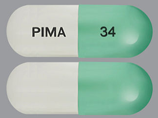 Esto es un Cápsula imprimido con PIMA en la parte delantera, 34 en la parte posterior, y es fabricado por None.