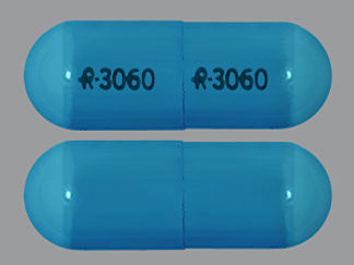 This is a Capsule Er 24 Hr imprinted with logo and 3060 on the front, logo and 3060 on the back.