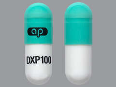 This is a light green oblong Capsule imprinted with logo on the front, DXP100 on the back, and is manufactured by AJANTA PHARMA L.