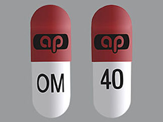 This is a Capsule imprinted with logo on the front, OM 40 on the back.