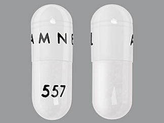 This is a Capsule imprinted with AMNEAL on the front, 557 on the back.