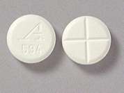 Zanaflex: Esto es un Tableta blanco redondo imprimido con logo and 594 en la parte delantera, nada en la parte posterior, y es fabricado por LEGACY PHARMA I.