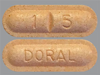 Esto es un Tableta imprimido con 1 5 en la parte delantera, DORAL en la parte posterior, y es fabricado por None.