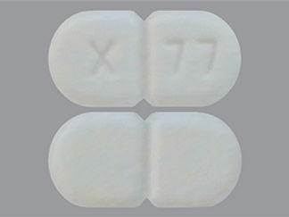 This is a Tablet imprinted with X  77 on the front, nothing on the back.