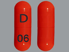 This is a orange oblong Capsule imprinted with D on the front, 06 on the back, and is manufactured by AUROBINDO PHARM.