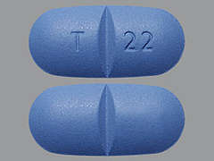 This is a dark blue oblong Tablet imprinted with T 22 on the front, nothing on the back, and is manufactured by AUROBINDO PHARM.