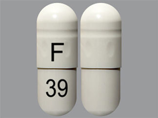 This is a Capsule imprinted with F on the front, 39 on the back.
