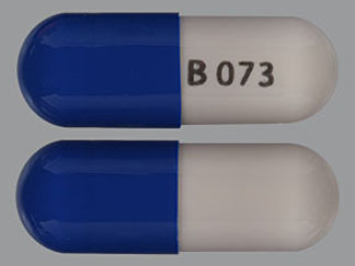 This is a Capsule imprinted with B 073 on the front, nothing on the back.