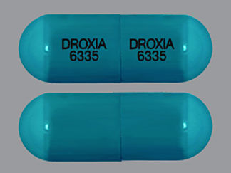 Esto es un Cápsula imprimido con DROXIA  6335 en la parte delantera, DROXIA  6335 en la parte posterior, y es fabricado por None.
