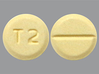 Esto es un Tableta imprimido con T2 en la parte delantera, nada en la parte posterior, y es fabricado por None.