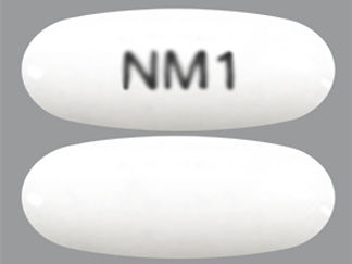 Esto es un Cápsula imprimido con NM1 en la parte delantera, nada en la parte posterior, y es fabricado por None.