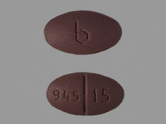 This is a Tablet imprinted with b on the front, 945 15 on the back.