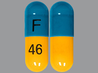 This is a Capsule imprinted with F on the front, 46 on the back.