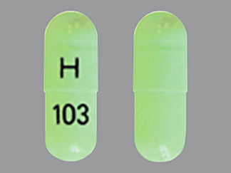 Esto es un Cápsula imprimido con H en la parte delantera, 103 en la parte posterior, y es fabricado por None.