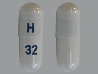 This is a Capsule imprinted with H on the front, 32 on the back.