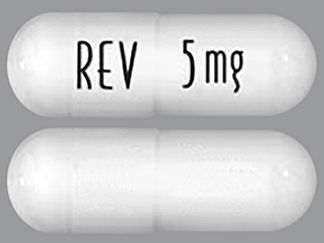 Esto es un Cápsula imprimido con REV en la parte delantera, 5 mg en la parte posterior, y es fabricado por None.