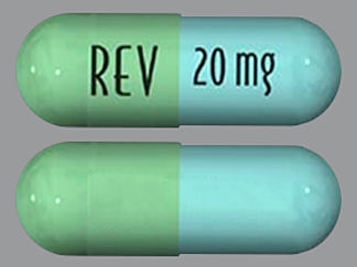 This is a Capsule imprinted with REV on the front, 20 mg on the back.