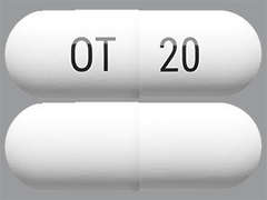 This is a white oblong Capsule Dr imprinted with OT on the front, 20 on the back, and is manufactured by CHIASMA INC..