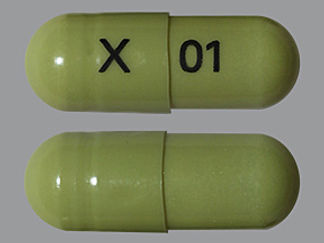 This is a Capsule Dr imprinted with X on the front, 01 on the back.