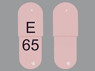 This is a Capsule Dr imprinted with E on the front, 65 on the back.