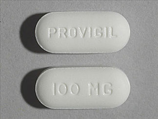 Esto es un Tableta imprimido con PROVIGIL en la parte delantera, 100 MG en la parte posterior, y es fabricado por None.