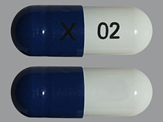 This is a Capsule Dr imprinted with X on the front, 02 on the back.