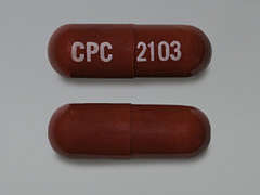 This is a maroon oblong Capsule imprinted with CPC on the front, 2103 on the back, and is manufactured by CYPRESS PHARM..