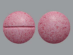 This is a pink round Tablet imprinted with nothing on the front, nothing on the back, and is manufactured by CVS.