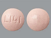 Acid Reducer: Esto es un Tableta rosado redondo imprimido con L141 en la parte delantera, nada en la parte posterior, y es fabricado por TOPCO.