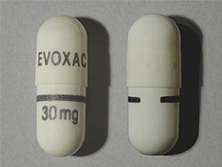 Esto es un Cápsula imprimido con EVOXAC en la parte delantera, 30mg en la parte posterior, y es fabricado por None.