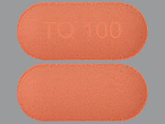 This is a Tablet imprinted with TQ 100 on the front, nothing on the back.