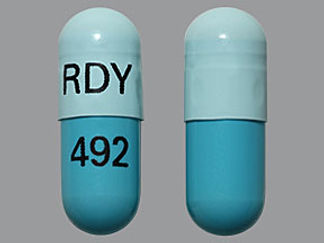 Esto es un Cápsula Dr imprimido con RDY en la parte delantera, 492 en la parte posterior, y es fabricado por None.