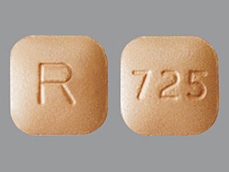 Esto es un Tableta imprimido con R en la parte delantera, 725 en la parte posterior, y es fabricado por None.